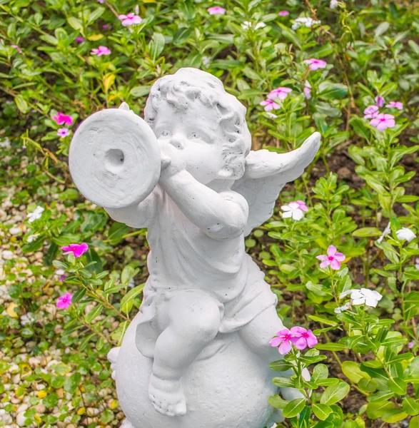 Fairy Statue in the garden with flower — Stock Photo, Image