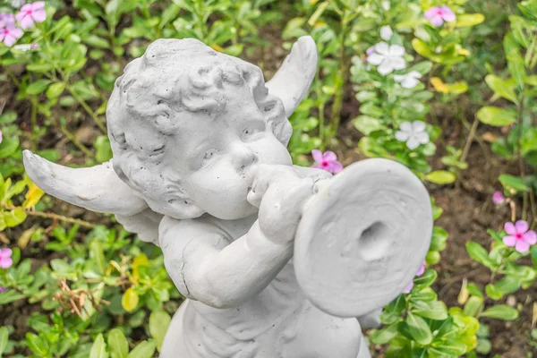 Fairy Statue in the garden with flower — Stock Photo, Image