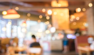 Bokeh imajı olan bir kafenin arka planı bulanık .