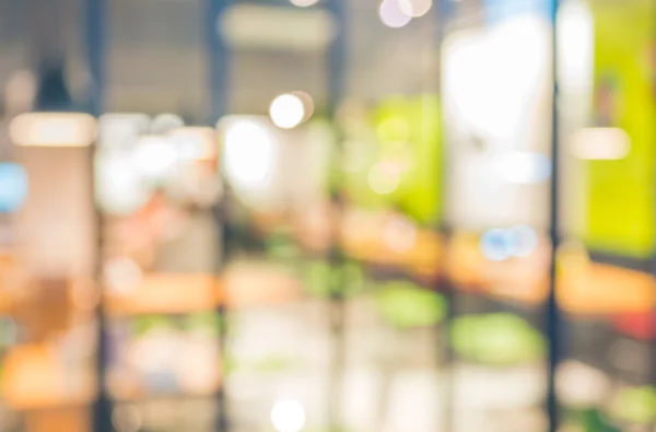 Coffee shop blur background with bokeh image .