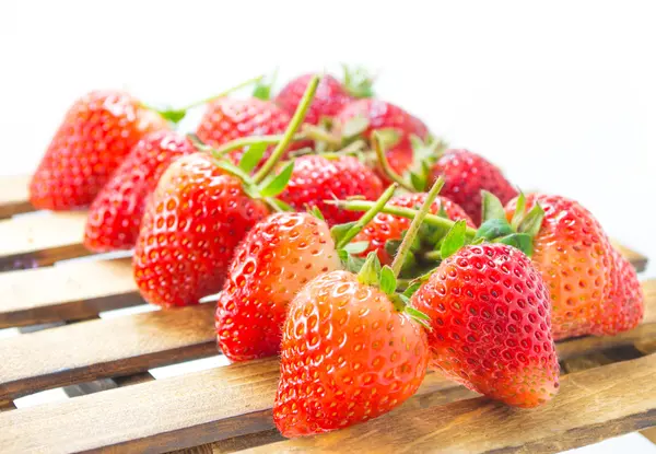 Fresh strawberry on wood table isolated on white background. — Stock Photo, Image