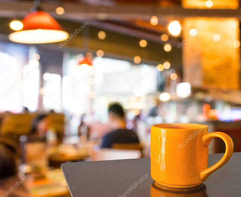 Empty wood table and Coffee shop blur background with bokeh imag