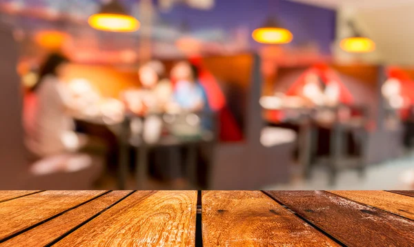 Empty brown wooden table and  Coffee shop blur background with bokeh image — Stock Photo, Image