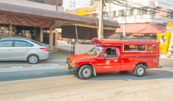 Blur image of Unidentified driver and tourists in red car vehicle — стоковое фото