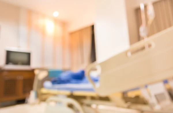 Blurred image of bed in hospital for background usage. — Stock Photo, Image
