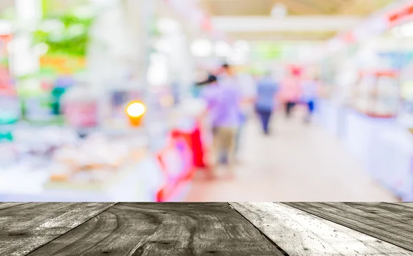 Blurred image of people walking at day market in sunny day. — Stock Photo, Image