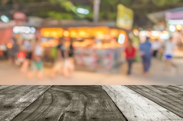 Onscherpe achtergrond. Straat versierd met feestelijke lichten. — Stockfoto