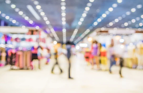 Imagem turva de shopping center e pessoas para uso em segundo plano. — Fotografia de Stock