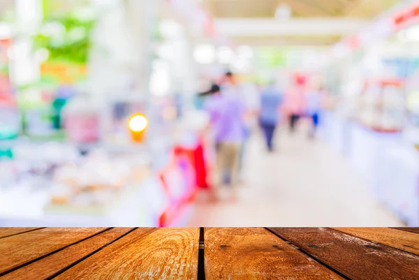 Blurred image of people walking at day market in sunny day. — Stock Photo, Image