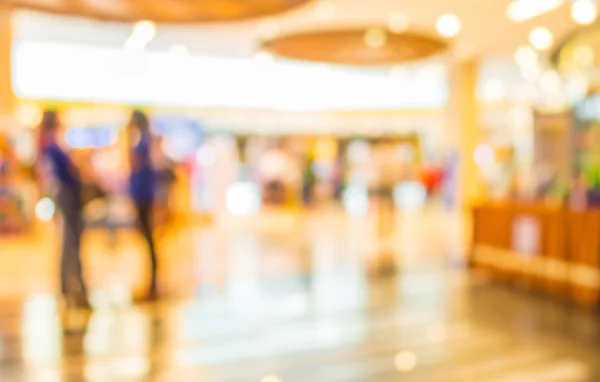 Imagem turva de shopping center e pessoas . — Fotografia de Stock