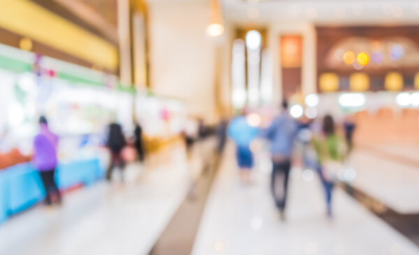 blurred image of shopping mall and people 