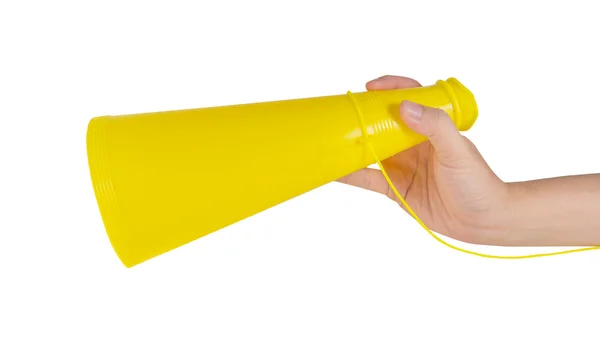 Image of male hand holding yellow plastic toy megaphone — Stock Photo, Image