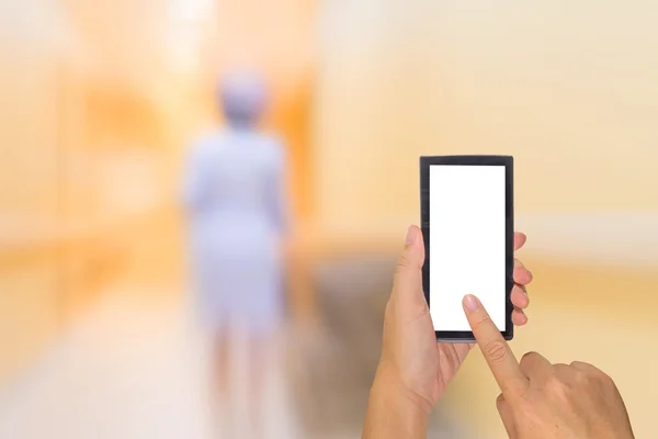 Blur image of nurse in hospital walkway and smartphone. — Stock Photo, Image