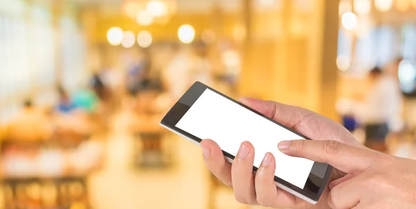 Erkek el bir modern dokunmatik ekran telefon tutarak ve görüntü bulanıklığı 