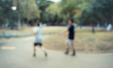 Vintage sesi bulanık görüntü için arka plan kullanım gün zamanında park bokeh ile insan faaliyetlerinin.