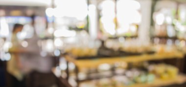 Arka plan kullanımı için kahve dükkanındaki bulanık fırın rafının görüntüsü .