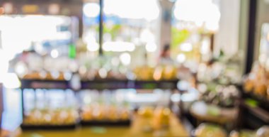 Arka plan kullanımı için kahve dükkanındaki bulanık fırın rafının görüntüsü .