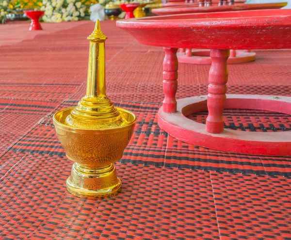 Golden pour water containers for Buddhist ceremony. — Stock Photo, Image