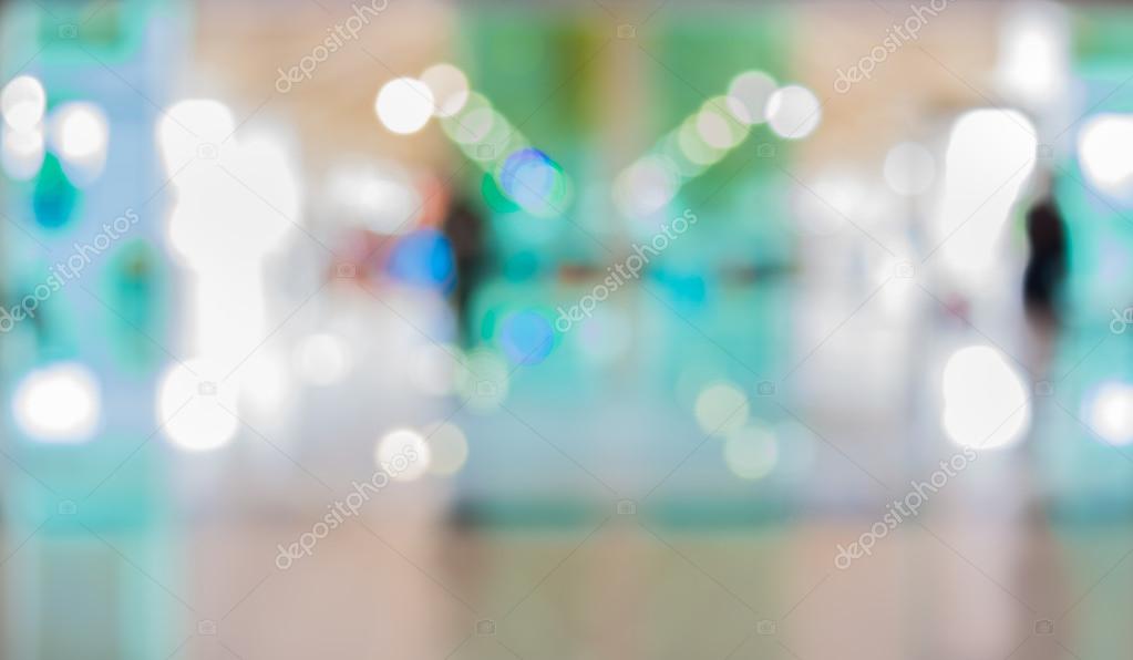 blur image of people in the lobby of a modern business center