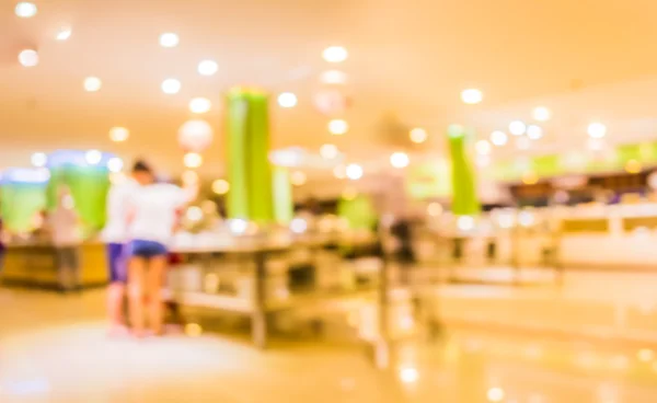 image of blur people at buffet catering room for background usage .