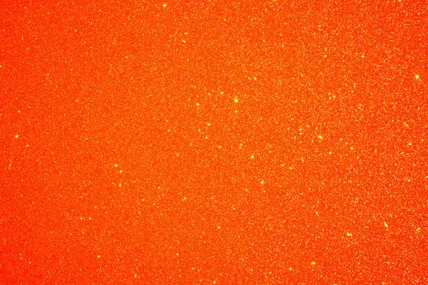 Orange Glitter background. Holiday, Christmas abstract texture.