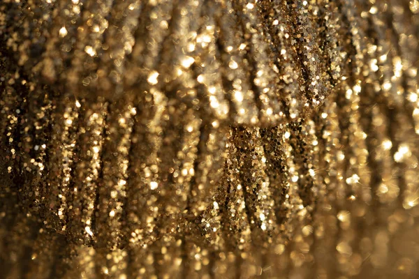 Close-up of beautiful golden Christmas ball as background. Selective focus , blurred photo. — Stock Photo, Image