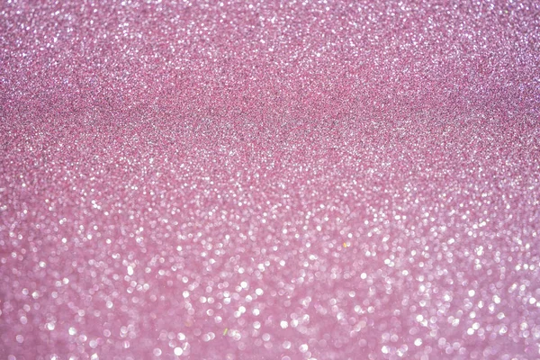 Rose pink glitter vintage lights background. Selective focus. Macro close-up.
