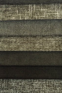 Koyu gri tonlarda kumaş koleksiyonu. Kumaş örneği. Çoklu renkli kumaş dokusu arkaplanı.