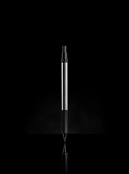 Pencil on dark background