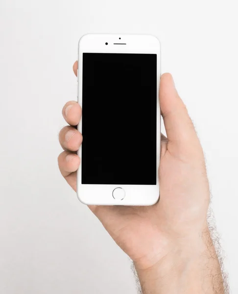 White iPhone 6S hold in hand — 스톡 사진