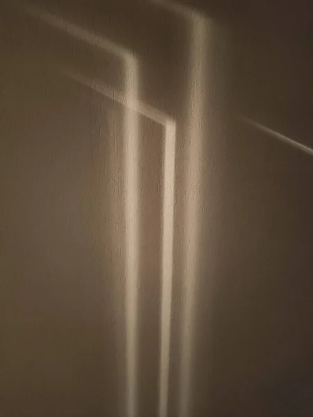 gray shadows on the wall in the room