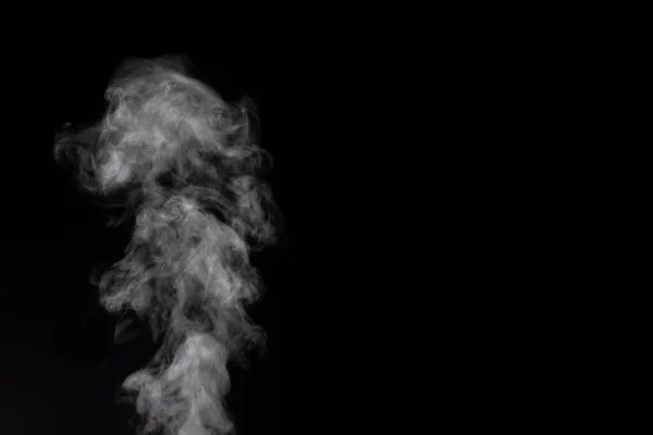 White smoke on black background. Figured smoke on a dark background. Abstract background, design element