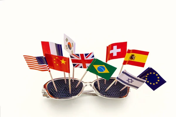 Travel concept - sunglasses with flags of different countries Spain Israel USA China Great Britain France Korea — Stock Photo, Image