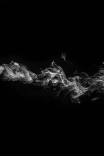 Horizontal curly white steam, fog or smoke isolated with transparent special effect on black background, vertical — Stock Photo, Image