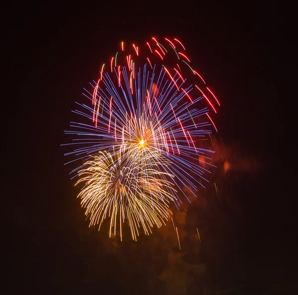 The evening fireworks in the sky in honor of celebration of Victory Day — Stock Photo, Image