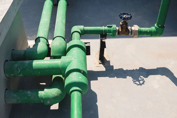 Pump systems and doors that open and close are commonly installed on pipes in the chemical industry, power plants, oil and gas. Piping systems on the roof of a large high-rise building.