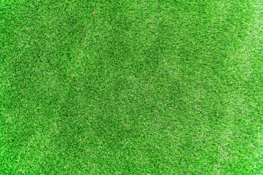 Yeşil yapay çim. Yapay çimen arka planı, yapay çimen arka planının üst görüntüsü.