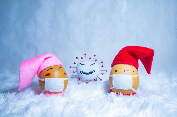 Cute painted eggs with corona virus doll to celebrate Christmas in times of covid pandemic. Fun indoor activity with kids. — Stock Image Cute Painted Eggs Corona Virus Doll Celebrate Christmas Times Covid Royalty Free Stock Images