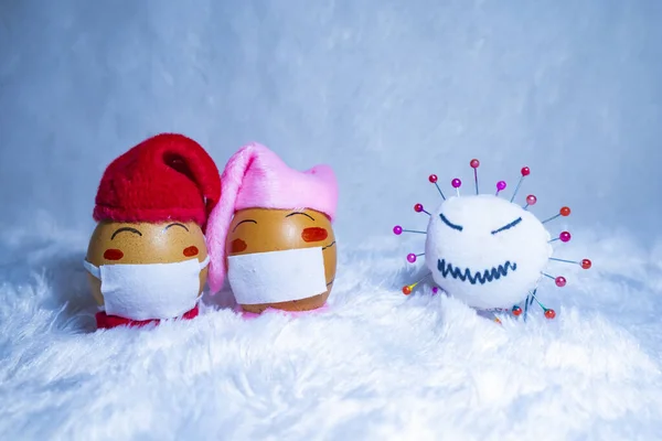 Cute painted eggs with corona virus doll to celebrate Christmas in times of covid pandemic. Fun indoor activity with kids. — Stock Image Cute Painted Eggs Corona Virus Doll Celebrate Christmas Times Covid Royalty Free Stock Images