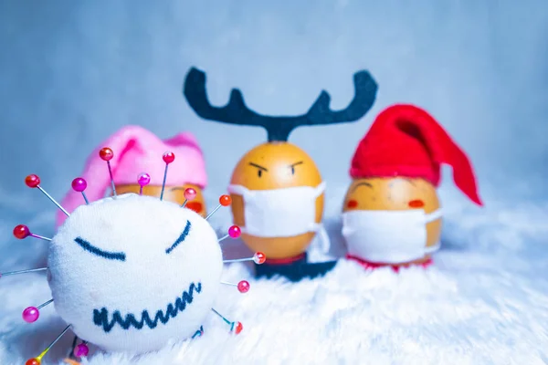 Cute painted eggs with corona virus doll to celebrate Christmas in times of covid pandemic. Fun indoor activity with kids. — Stock Image Cute Painted Eggs Corona Virus Doll Celebrate Christmas Times Covid Royalty Free Stock Images
