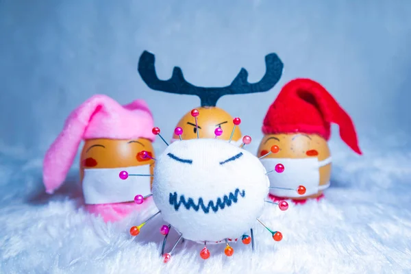 Cute painted eggs with corona virus doll to celebrate Christmas in times of covid pandemic. Fun indoor activity with kids. — Stock Image Cute Painted Eggs Corona Virus Doll Celebrate Christmas Times Covid Stock Image