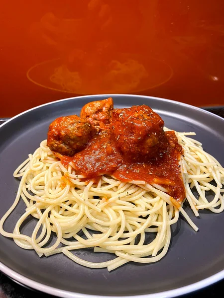 Spaghetti Pasta Meat Balls Tomato Sauce Gray Plate Orange Background Stock Kép