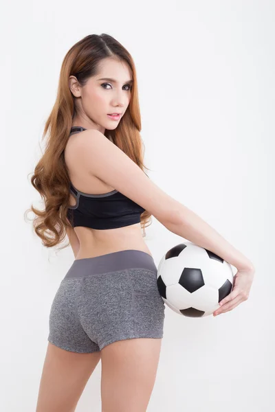 Jeune femme sexy avec ballon de football — Photo