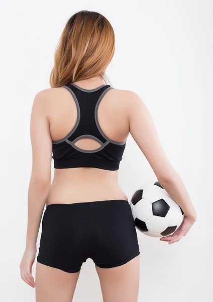 Jeune femme sexy avec ballon de football — Photo