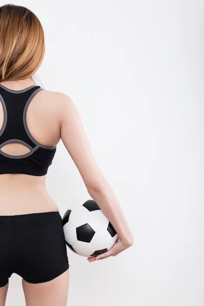 Mladá sexy žena s fotbalovým míčem — Stock fotografie