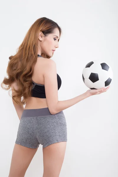 Mladá sexy žena s fotbalovým míčem — Stock fotografie