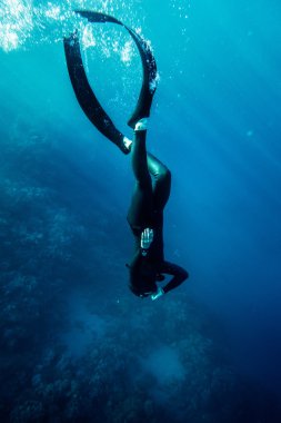 Freediver swim in the sea clipart