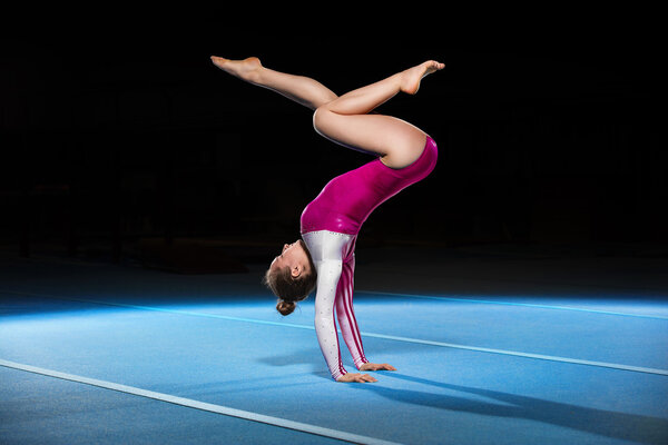 portrait of young gymnasts competing in the stadium