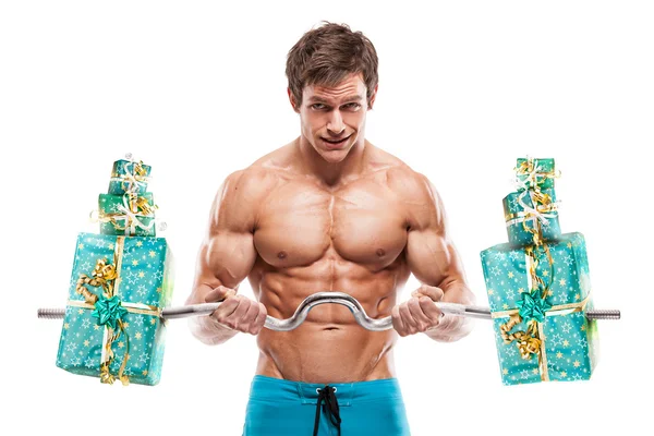 Musclé bodybuilder gars avec des cadeaux — Photo