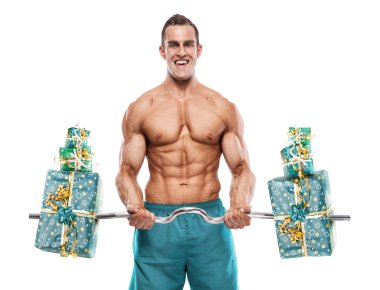 Muscular bodybuilder guy doing exercises with gifts over white b clipart